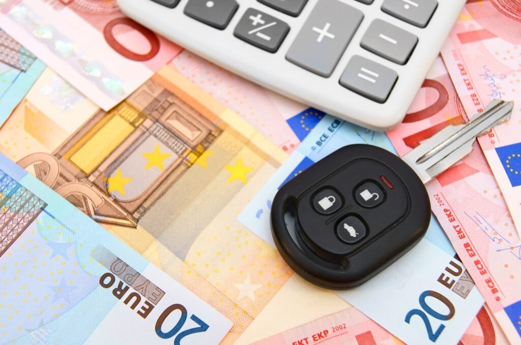 Keys from the car on money.